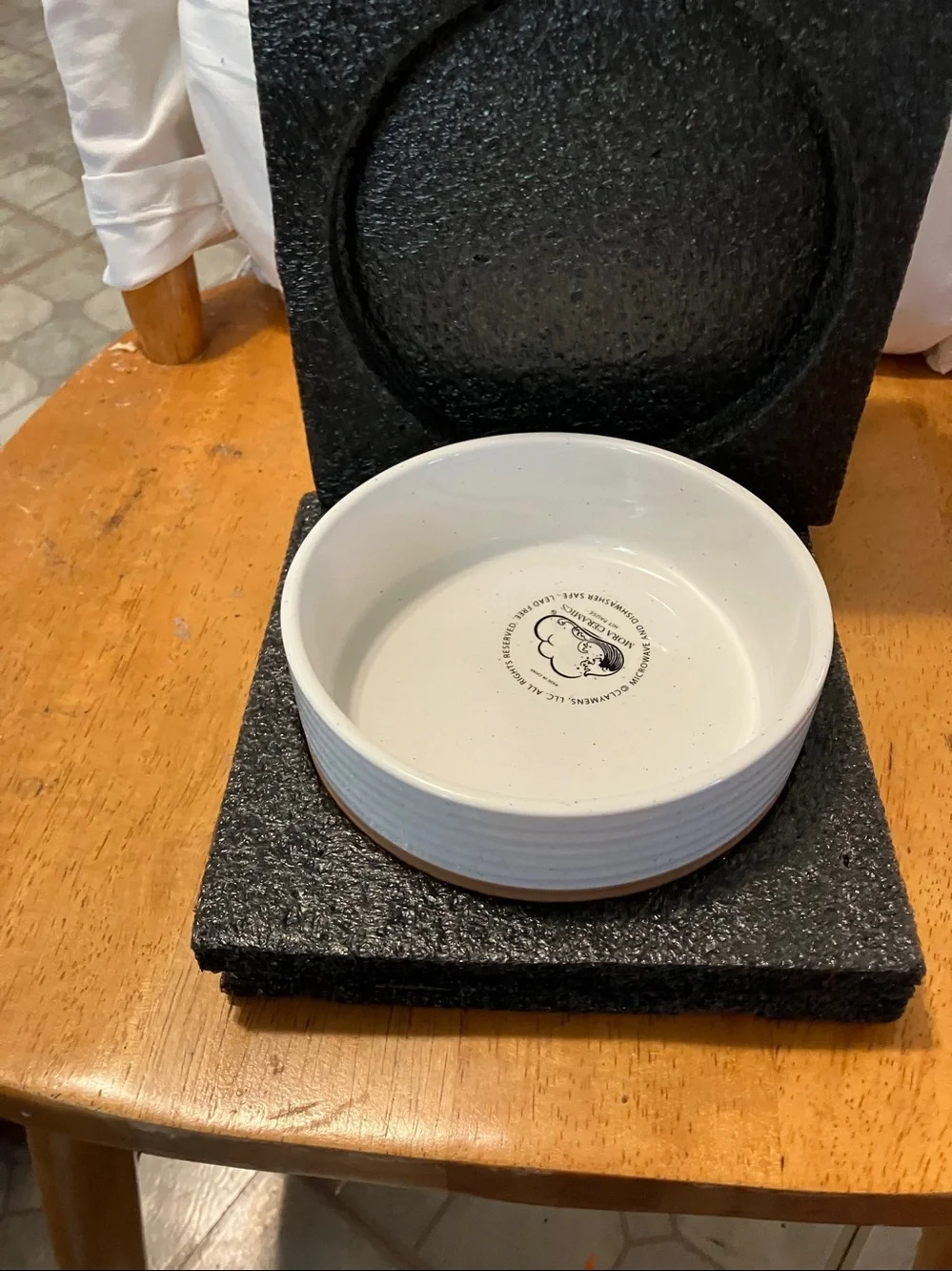 New.  Mora Ceramics tan n white dog bowl in perfect condition